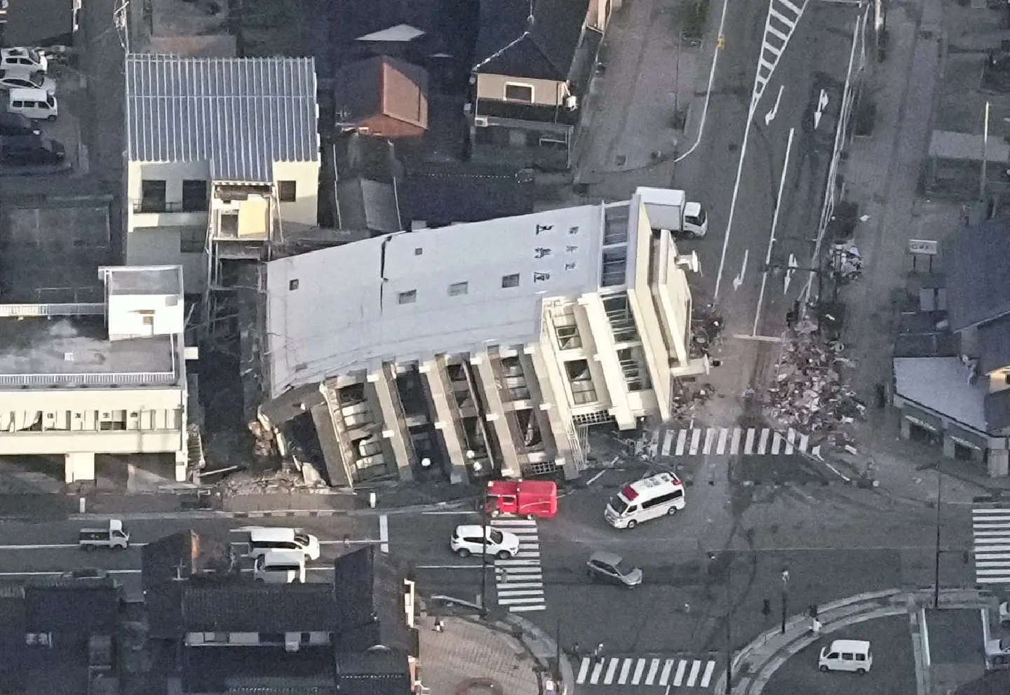 Deadly quakes kill 13, level buildings on Japan’s west coast