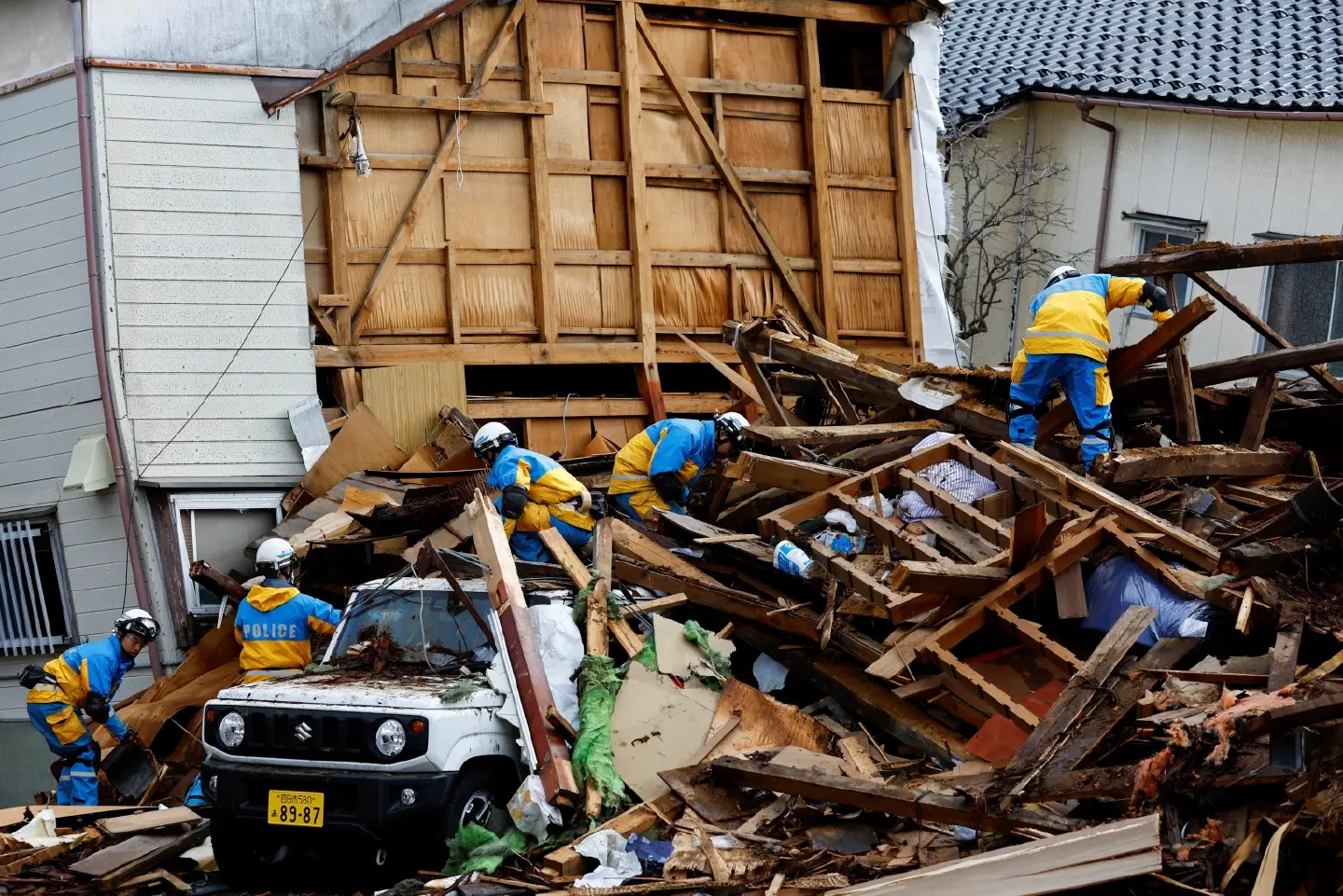 Survivors are found in homes smashed by Japan quake that killed 94 people