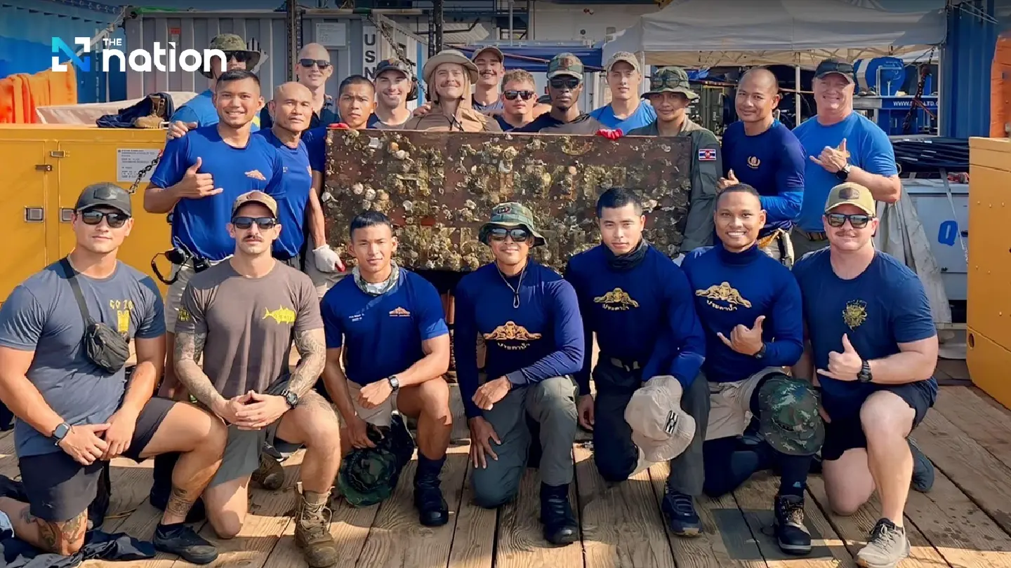 Divers retrieve the nameplate of ill-fated 'HTMS Sukhothai'