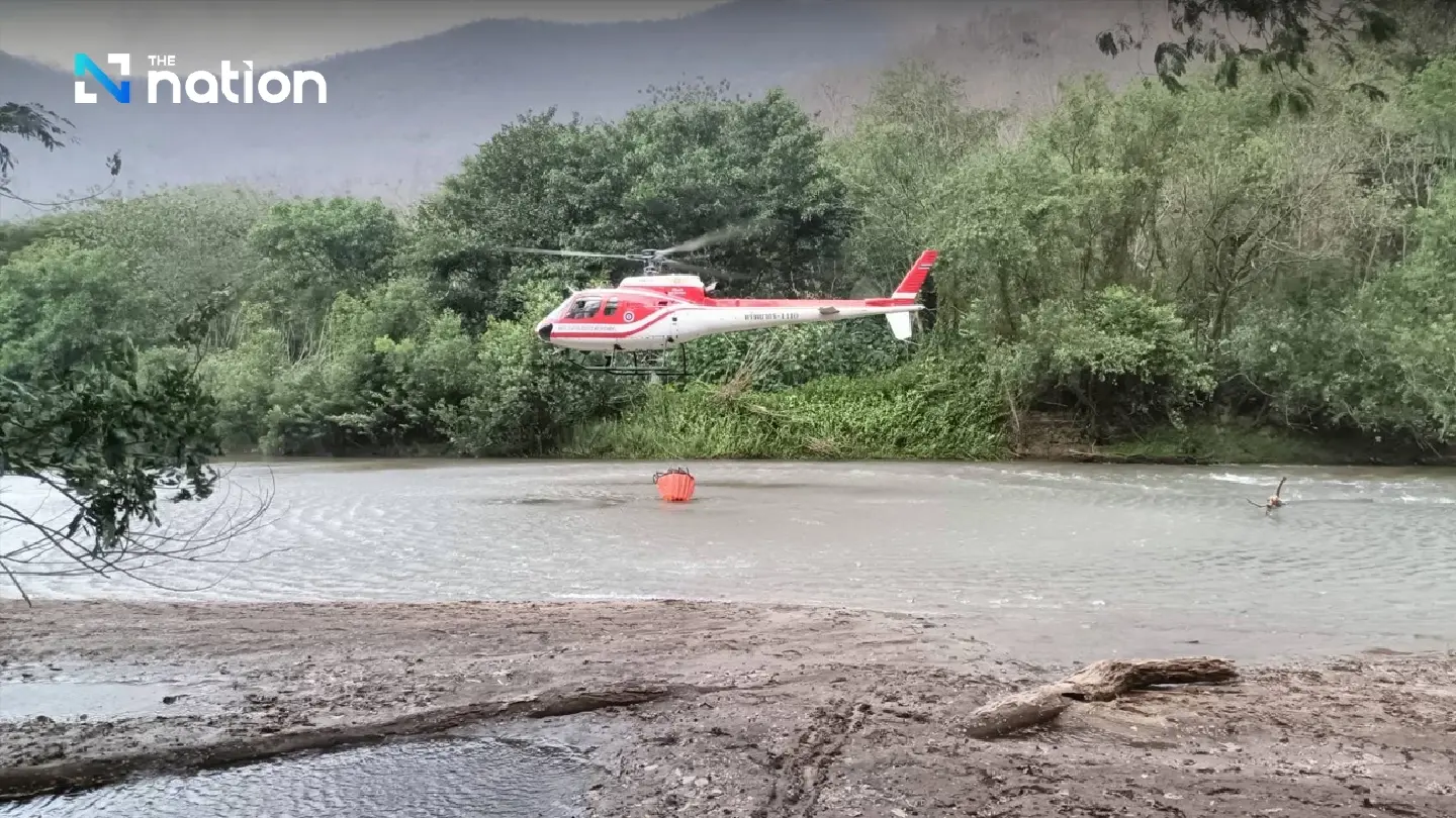 Firefighters and helicopters halt huge Chiang Mai forest fire