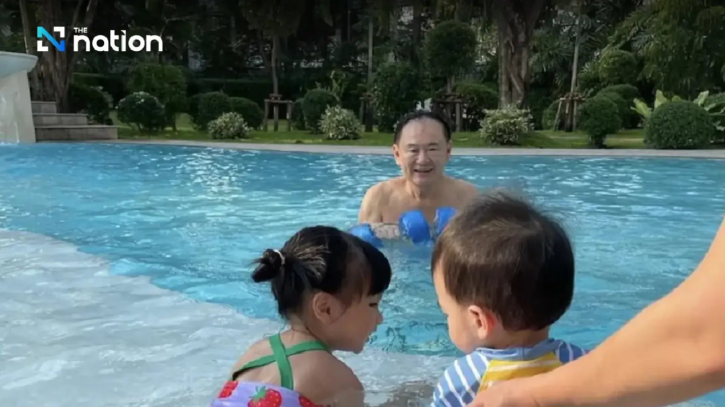 Dumbbells and cuddles as Thaksin enjoys pool playdate with grandkids