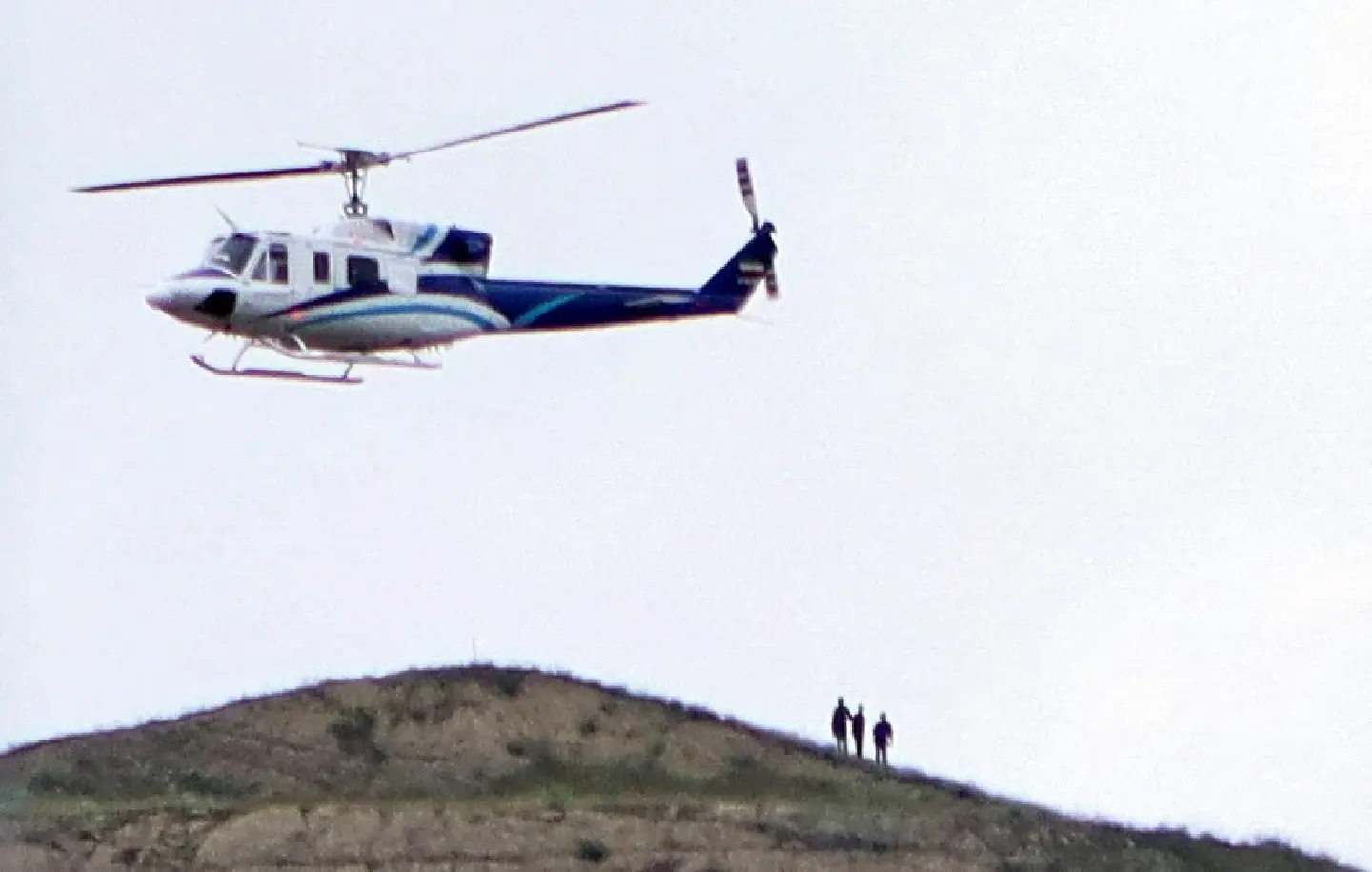 Rescuers spot crashed helicopter carrying Iran's president from afar Rescuers spot crashed helicopter carrying Iran's president from afar