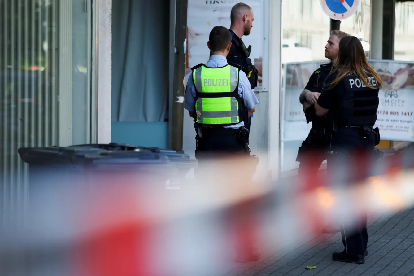 German police search a western city for a knife attacker who killed 3 at a festival