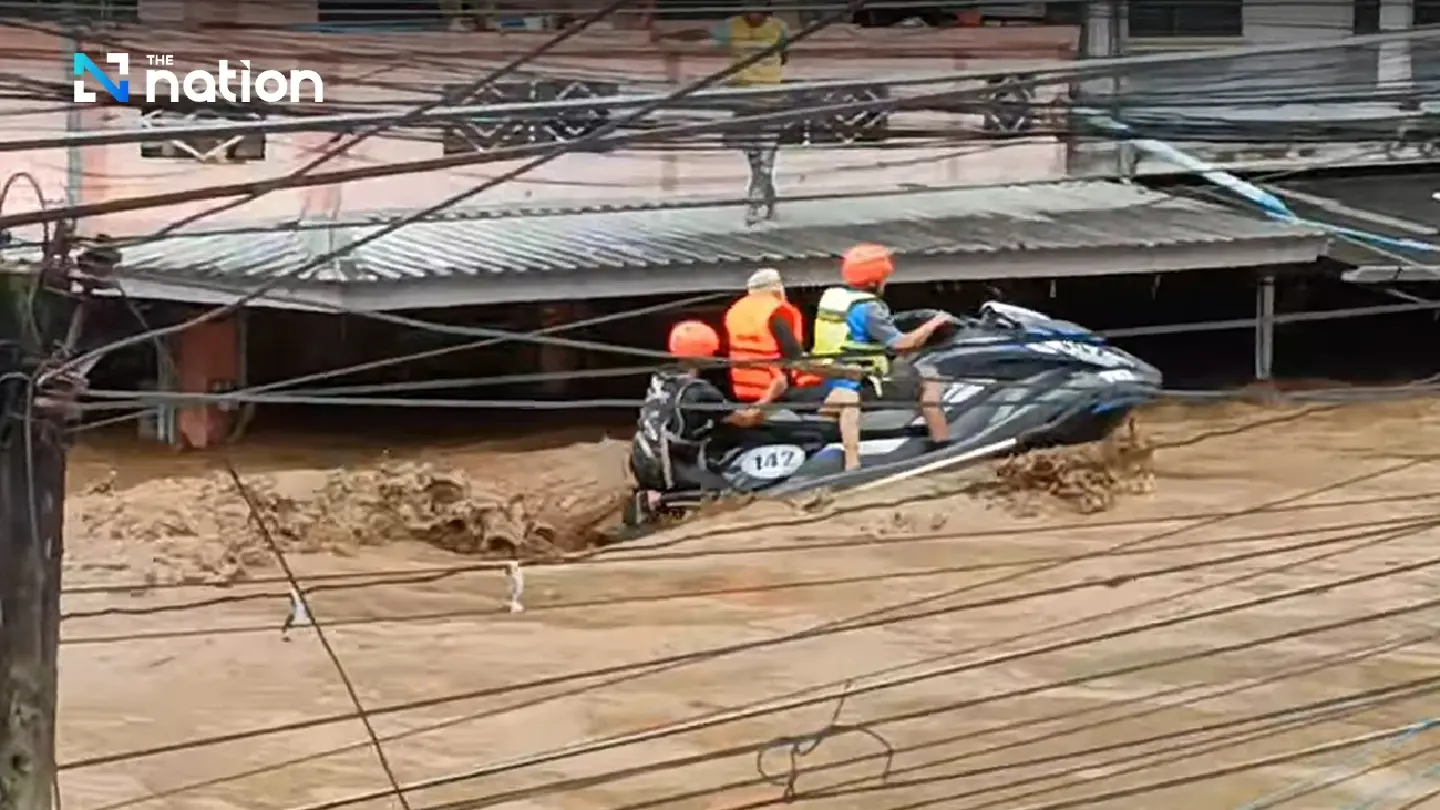 Man, 85, stranded atop tent in flooded district in Chiang Rai rescued