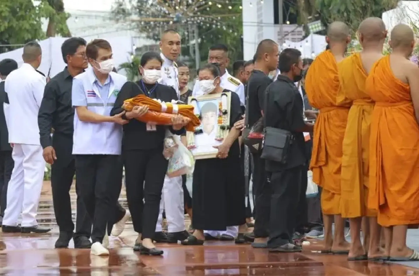 Grief and anger as Thai town holds mass cremation for 23 school bus fire victims
