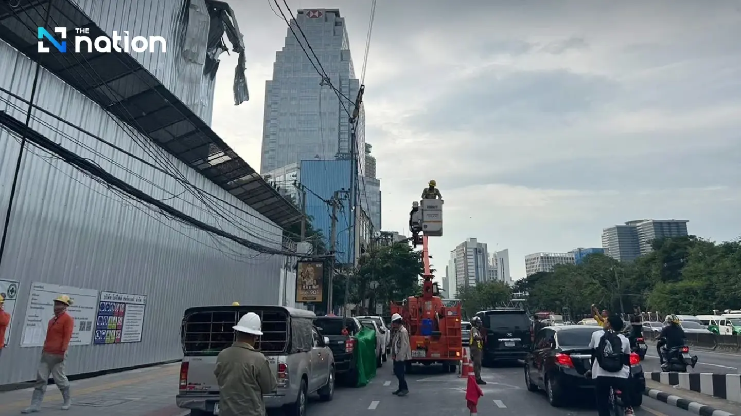 Car, power lines damaged by mishap during building demolition