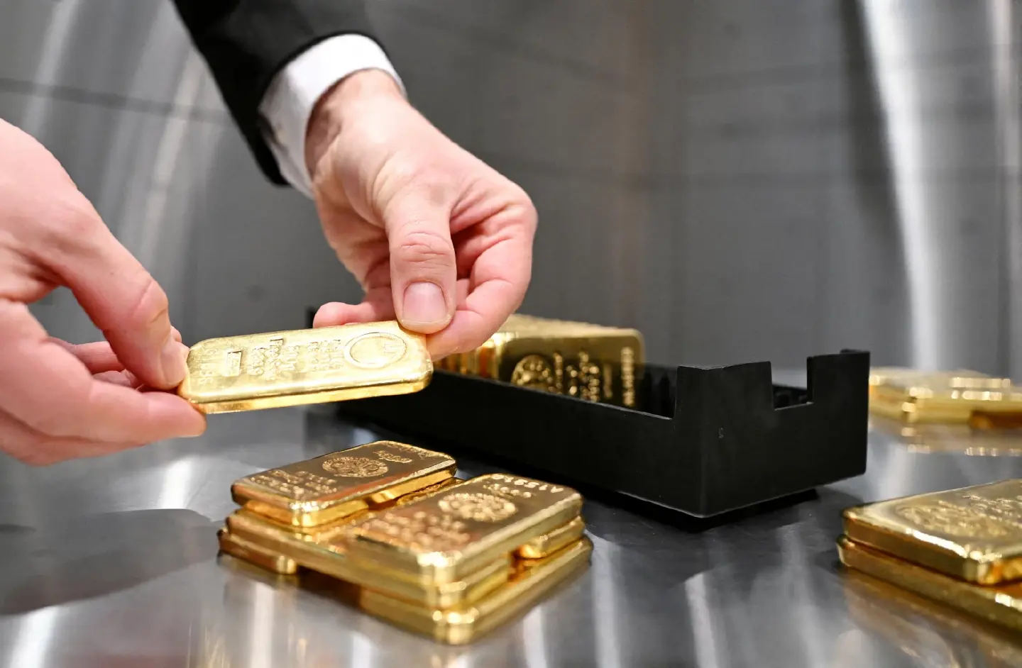 Gold rises on weaker dollar, trade war fears after Trump tariffs