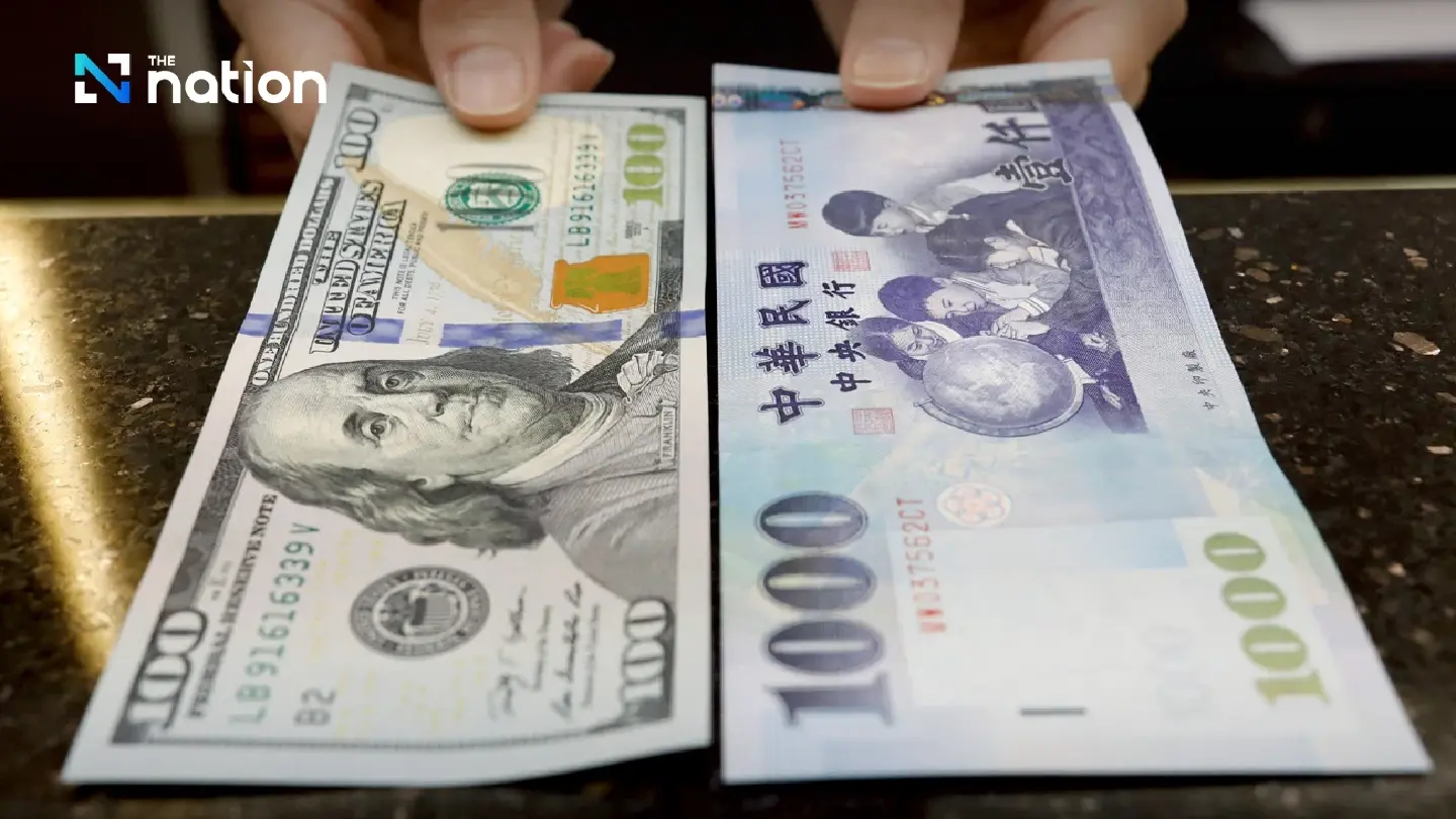 Taiwan dollar surges; Hong Kong intervenes to defend peg