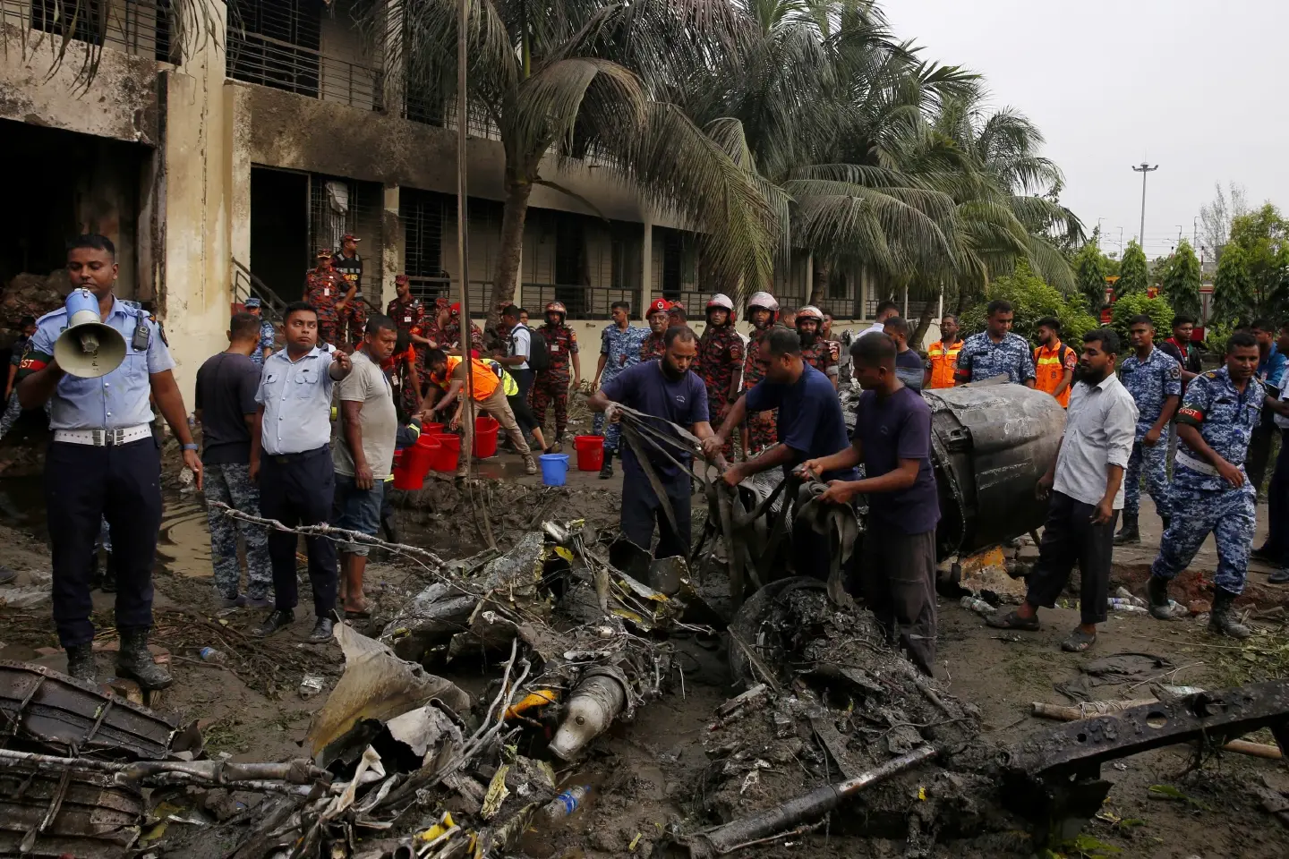 At least 19 killed, scores injured as Bangladesh air force jet crashes into college campus At least 19 killed, scores injured as Bangladesh air force jet crashes into college campus