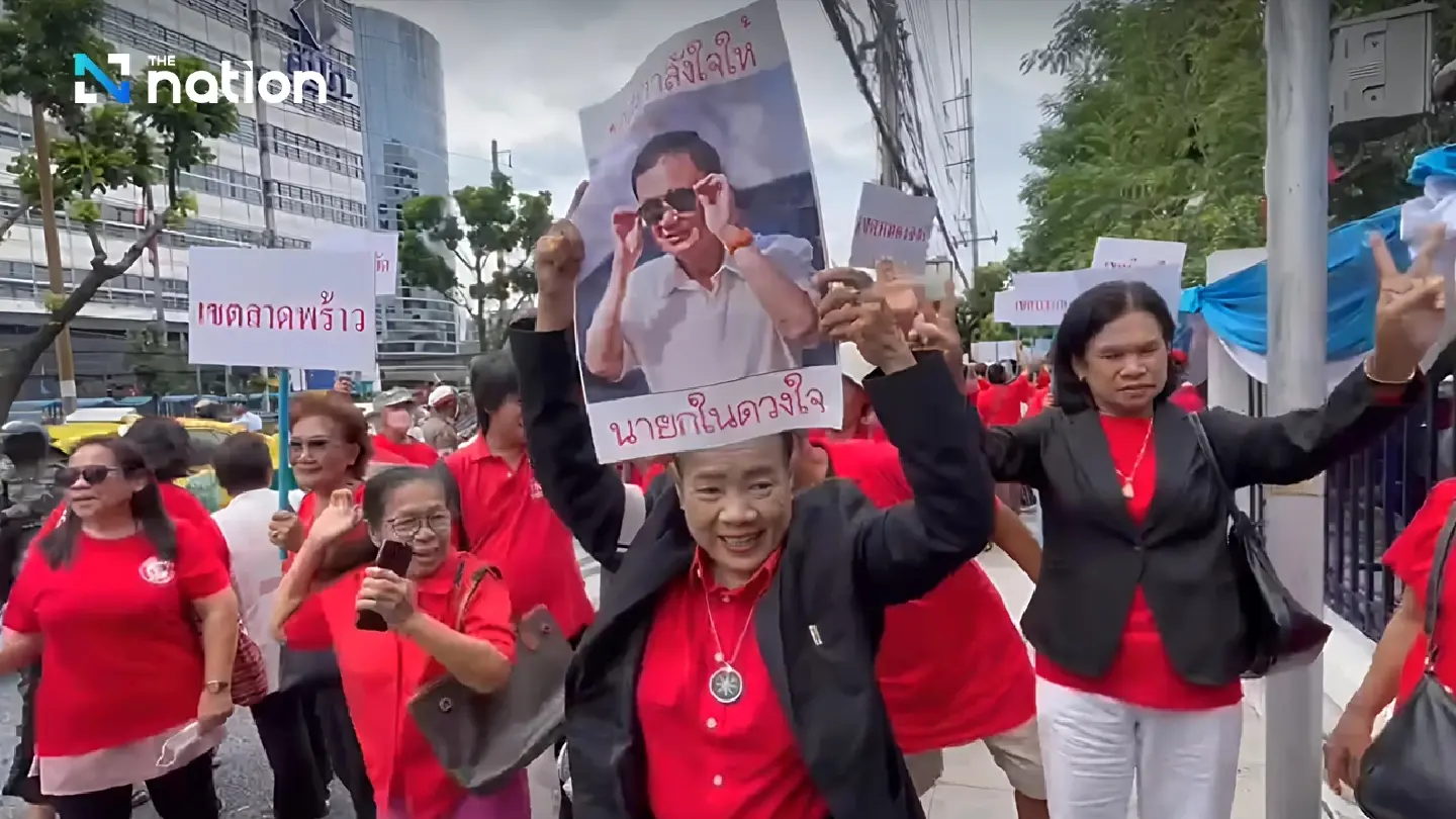 Red-shirt supporters celebrate as court acquits Thaksin in lèse-majesté case