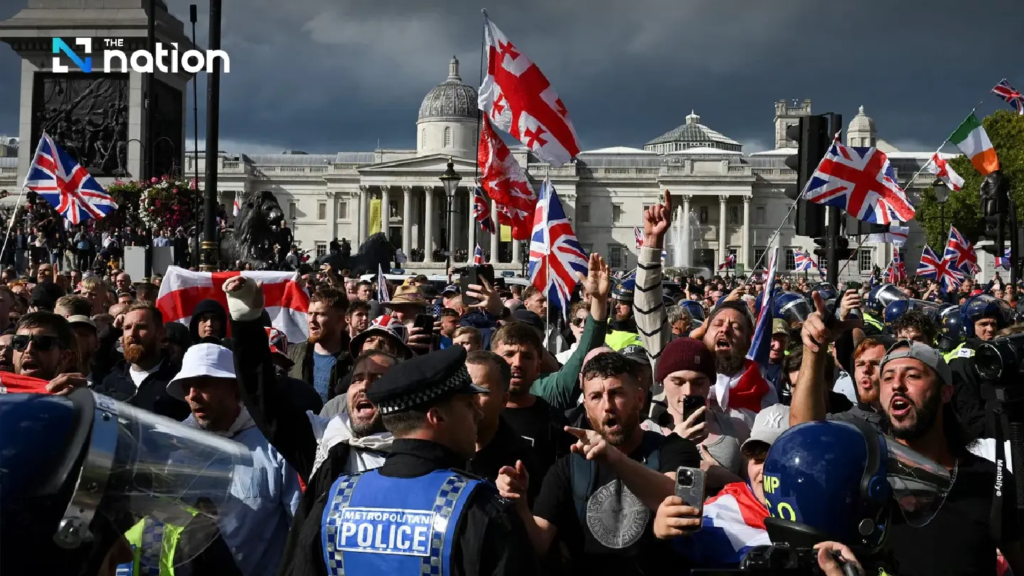 Police and protesters scuffle as 110,000 join anti-migrant London protest