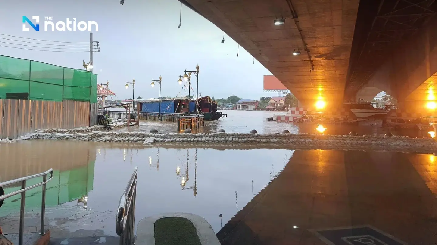Authorities warn of high tides as Chao Phraya River overflows riverside walkway