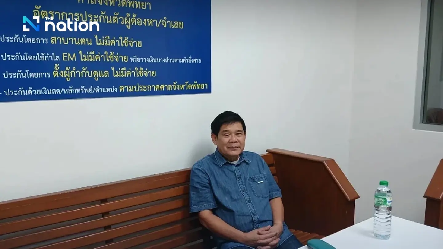 Nisit Sindhuprai surrenders to police after fleeing four-year jail sentence over ASEAN summit protest