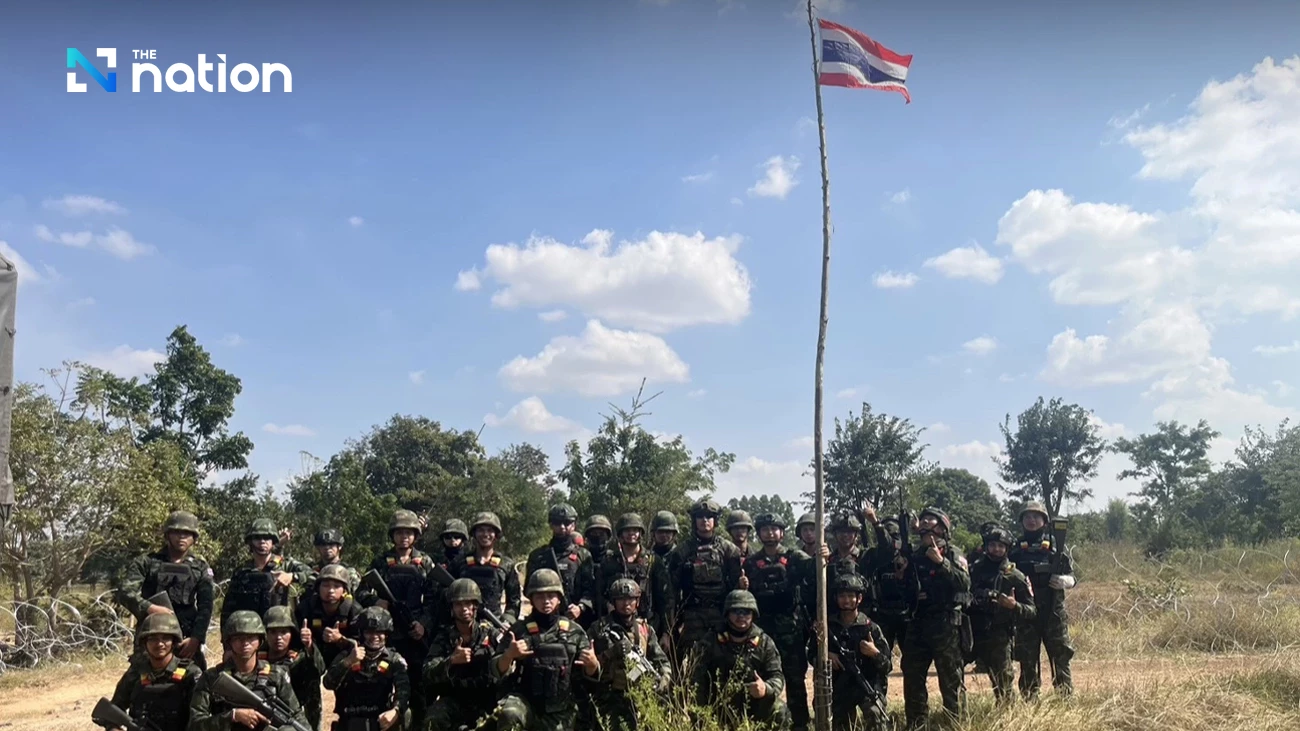 Thai troops raise national flag after reclaiming territory from Cambodia in Ta Phraya, Sa Kaeo