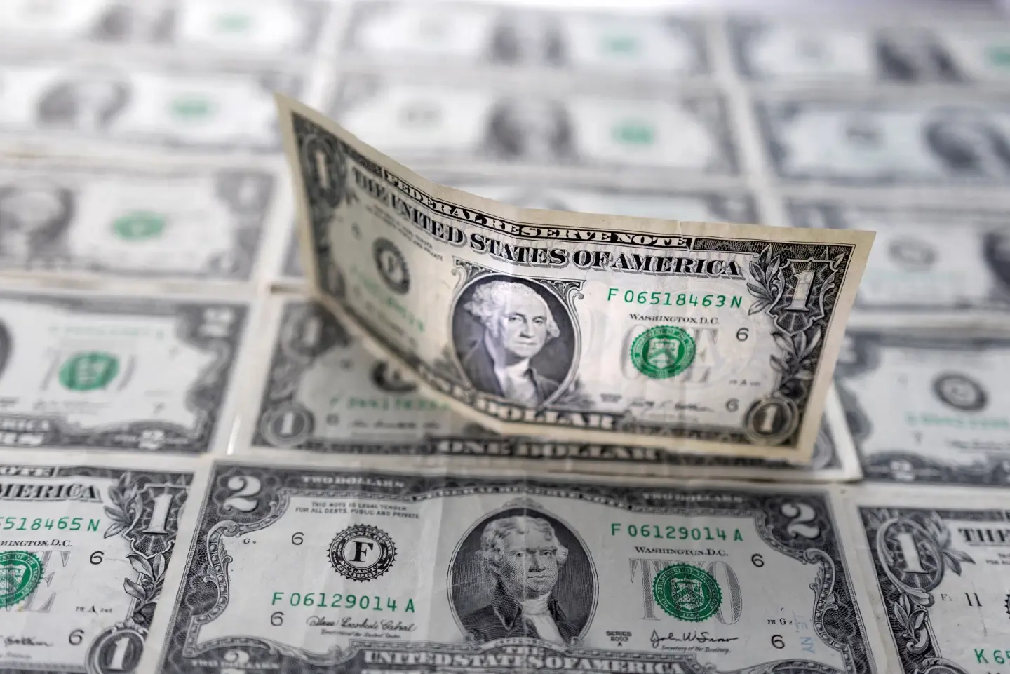 Dollar briefly dives below 153 yen amid wariness over intervention