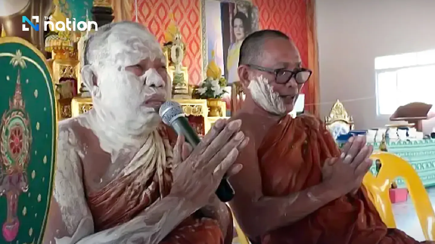 Surin monks covered in white powder during Songkran rite Surin monks covered in white powder during Songkran rite