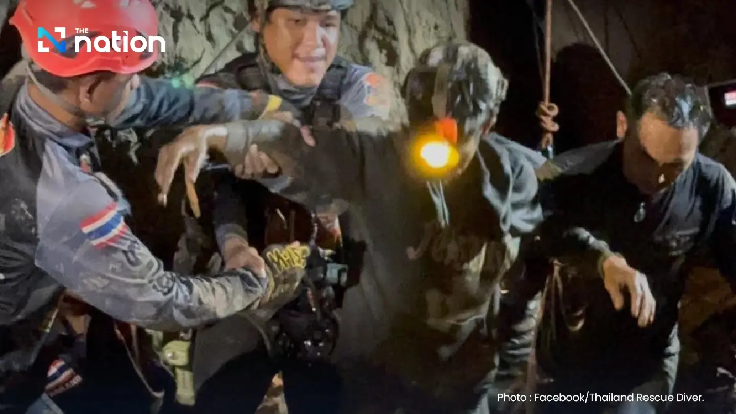 Rescuers bring first Lao worker to safety from flooded cave